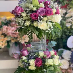 Vase with Natural Shades of Purple Roses